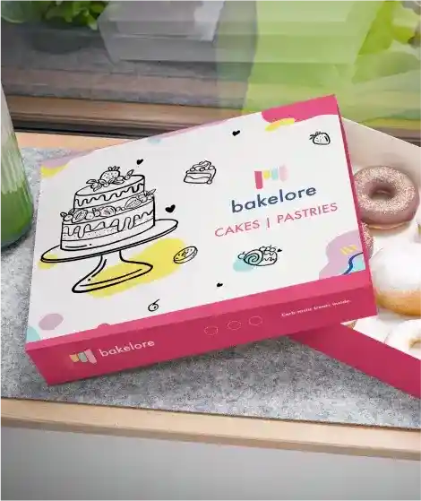 a box of doughnuts sitting on top of a counter.